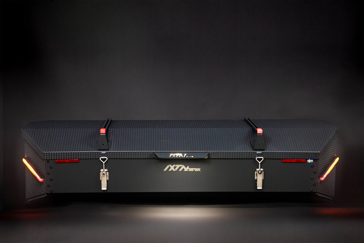 XTAbox Pro towbar-mounted cargo box, black Noir100 finish, front view